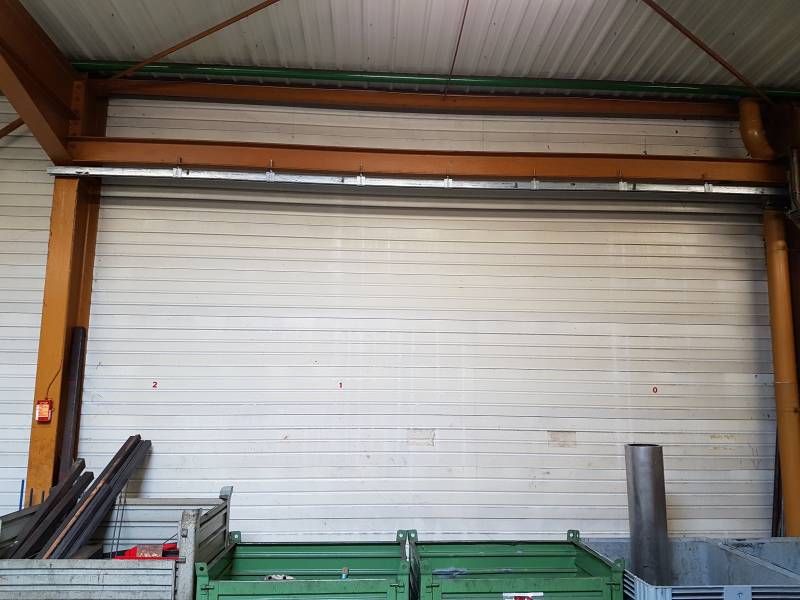 Fourniture et pose d'une porte sectionnelle motorisée dans la vallée d'Azergues